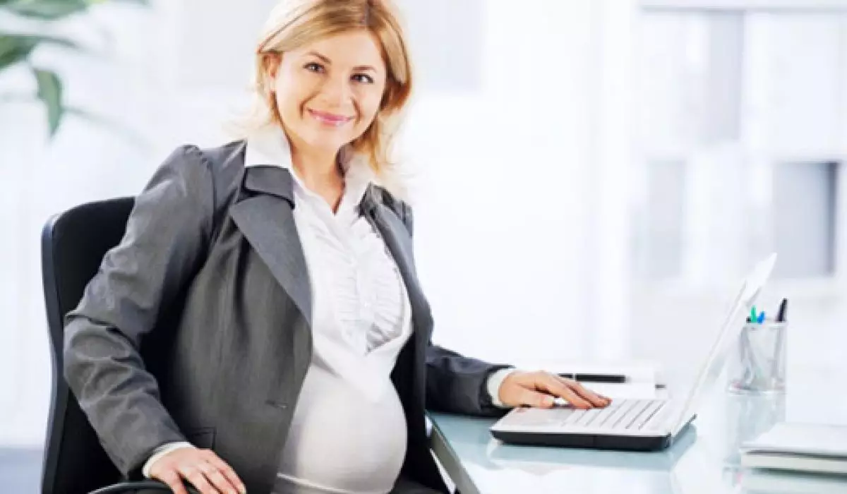 Portrait of pregnant business woman. She is working on a laptop in her office, and looking at camera. 

[url=http://www.istockphoto.com/search/lightbox/9786622][img]http://dl.dropbox.com/u/40117171/business.jpg[/img][/url]